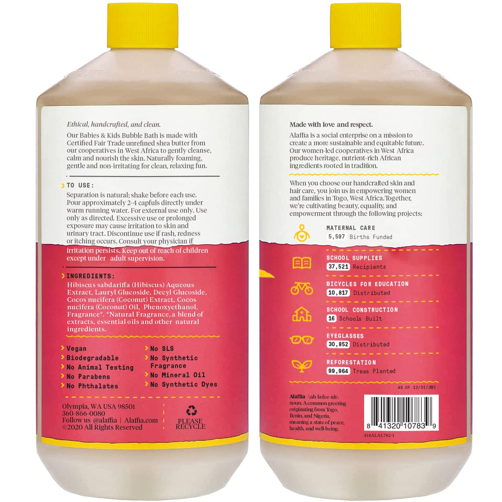 Alaffia bubble bath with coconut strawberry bubbles in a tub.