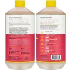 Alaffia bubble bath with coconut strawberry bubbles in a tub.