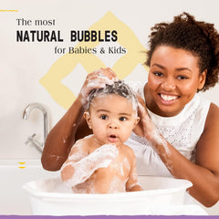 Alaffia bubbles close-up; gentle, playful foam for kids' bath time.