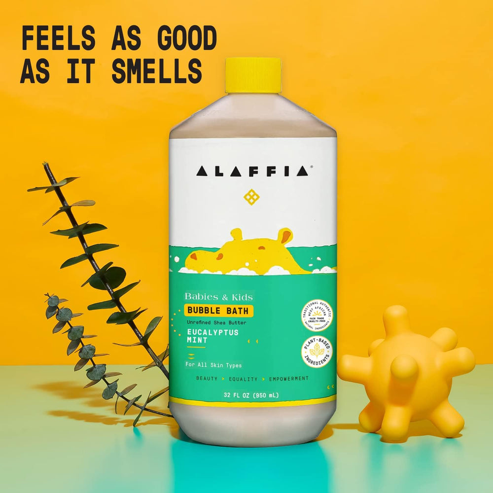 Alaffia Babies Bubble Bath in a tub with a child enjoying a calm bath.