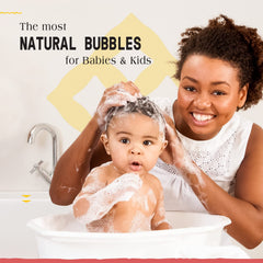 Alaffia Coconut Strawberry fragrance close-up with creamy bubbles for bedtime.