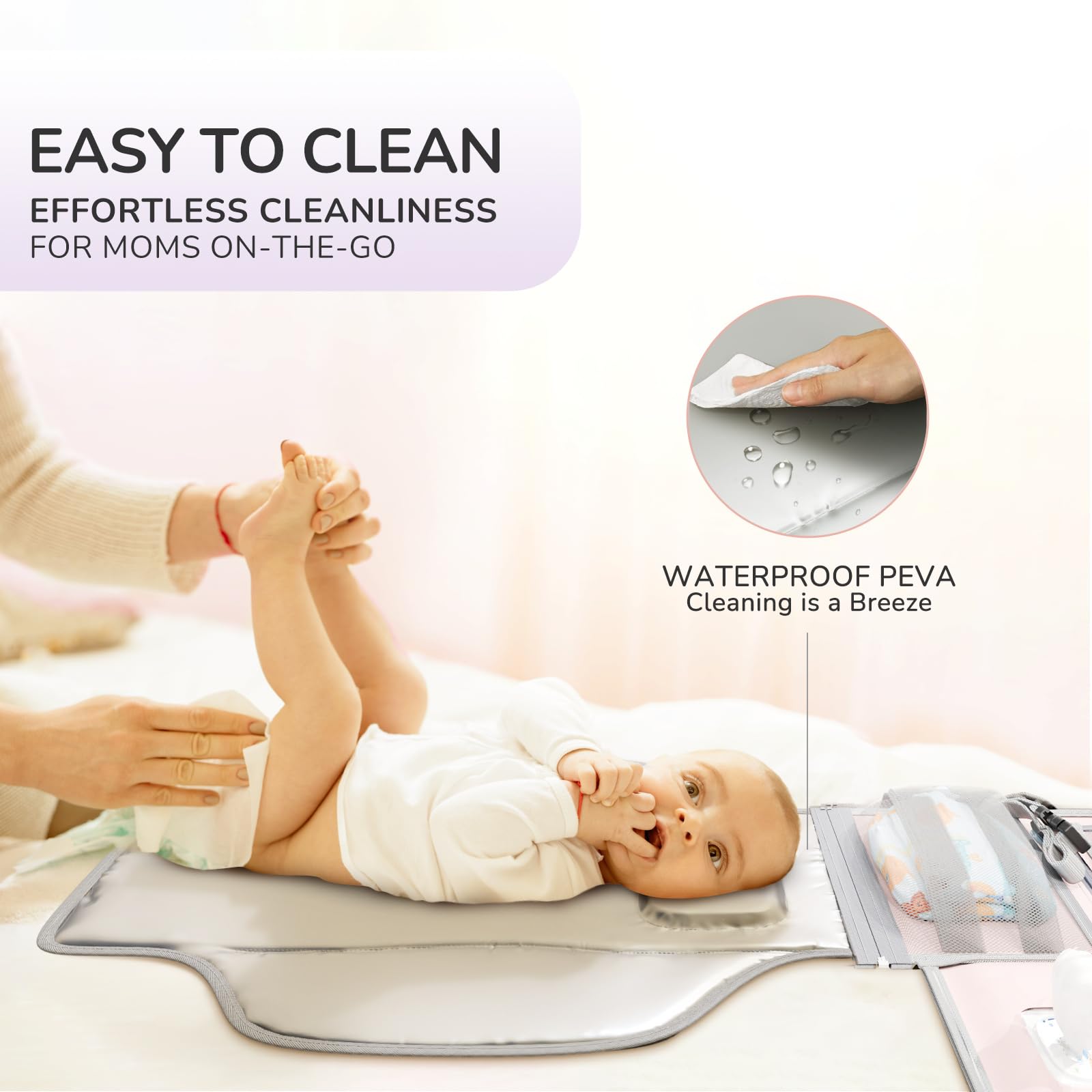 Alatino portable changing pad waterproof surface allows quick cleanup after messes.