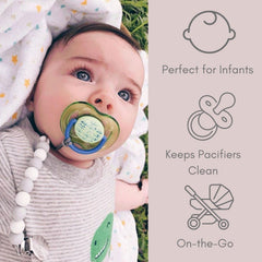 Ali+Oli pacifier clip in use with baby's pacifier during outings.