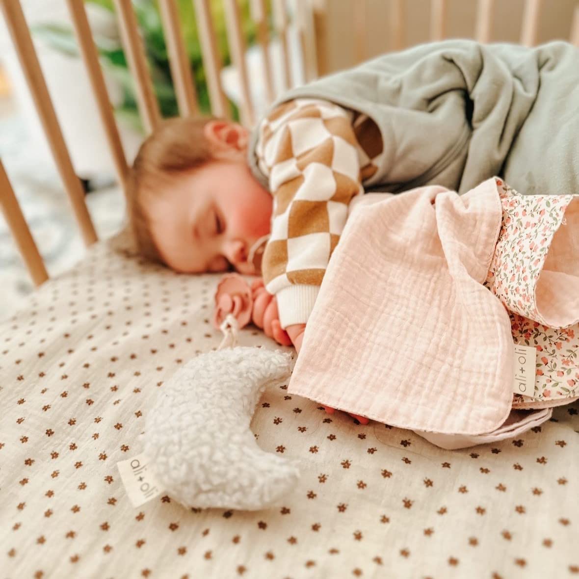 Ali+Oli plush pacifier holder is machine washable for easy cleanup