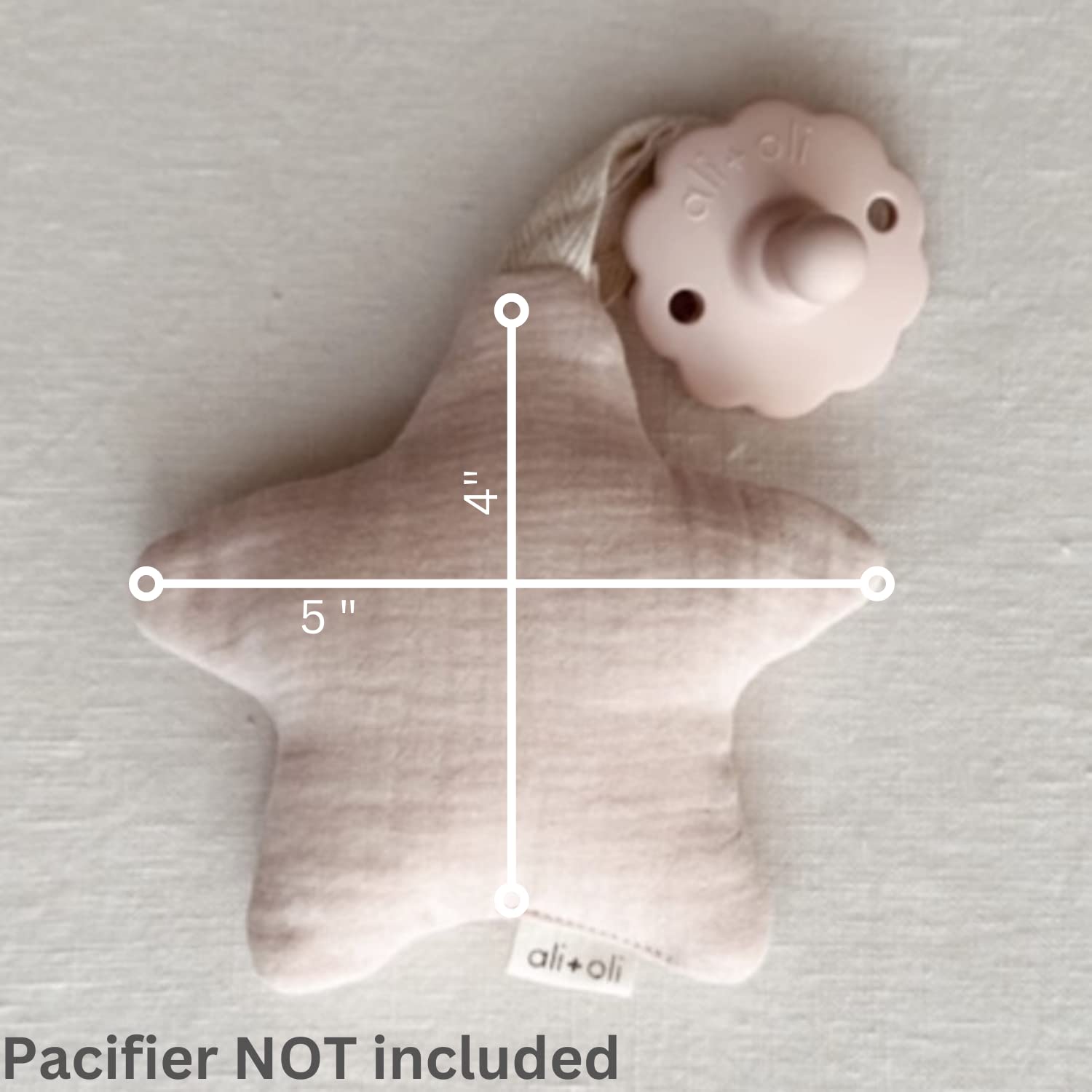 Ali+Oli plush pacifier holder moon-sand keeps pacifier handy during travel and playtime.
