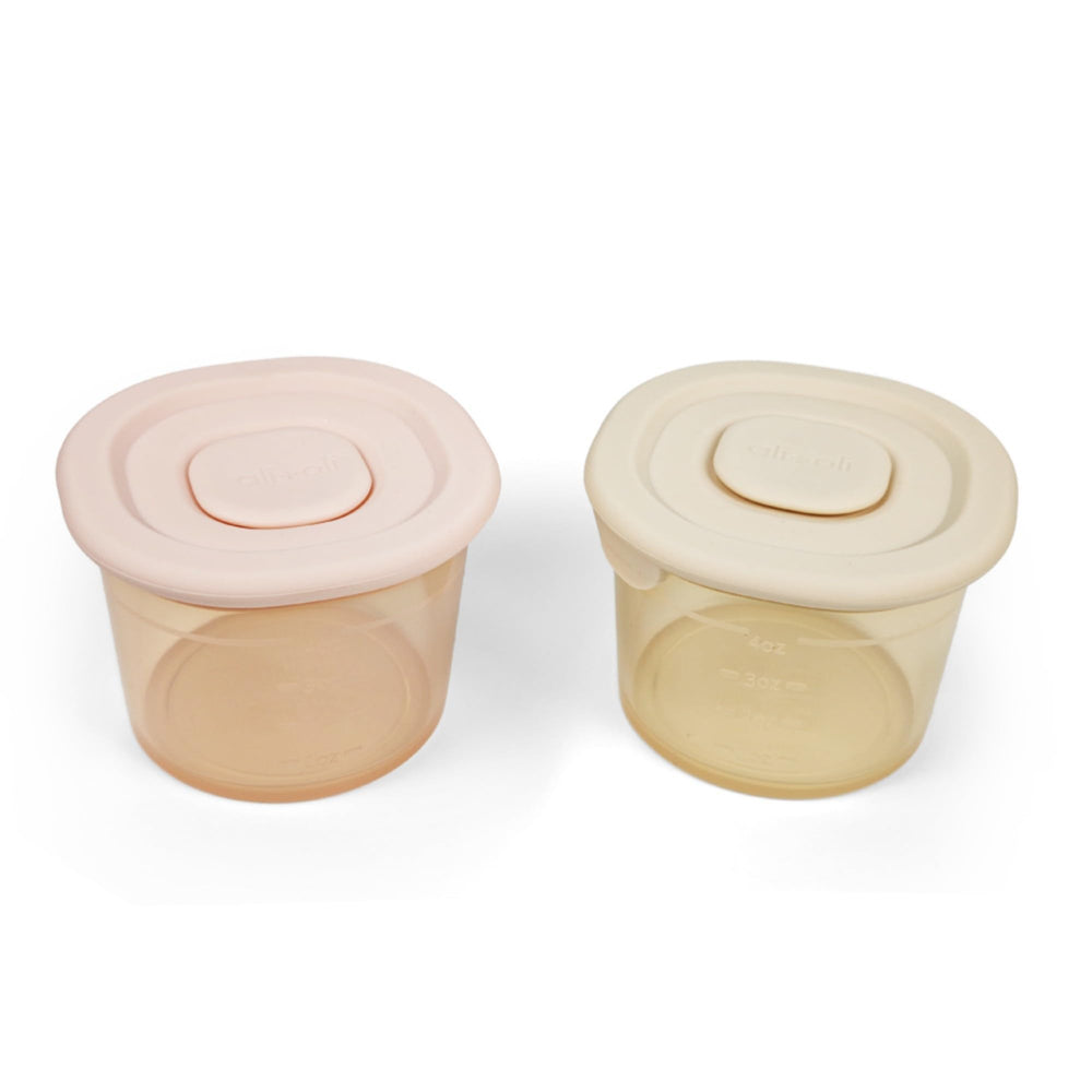 Ali+Oli silicone baby food containers 4oz two-pack with clear measurements for precise portions.