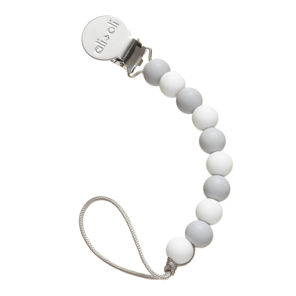 Ali+Oli silicone pacifier clip thin grey closeup keeps pacifier clean and accessible.