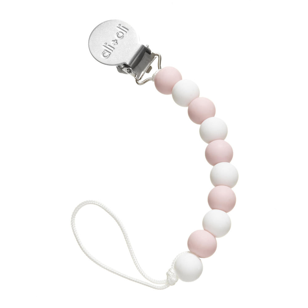 Ali+Oli silicone pacifier clip thin pink closeup, durable silicone helps keep pacifiers within easy reach