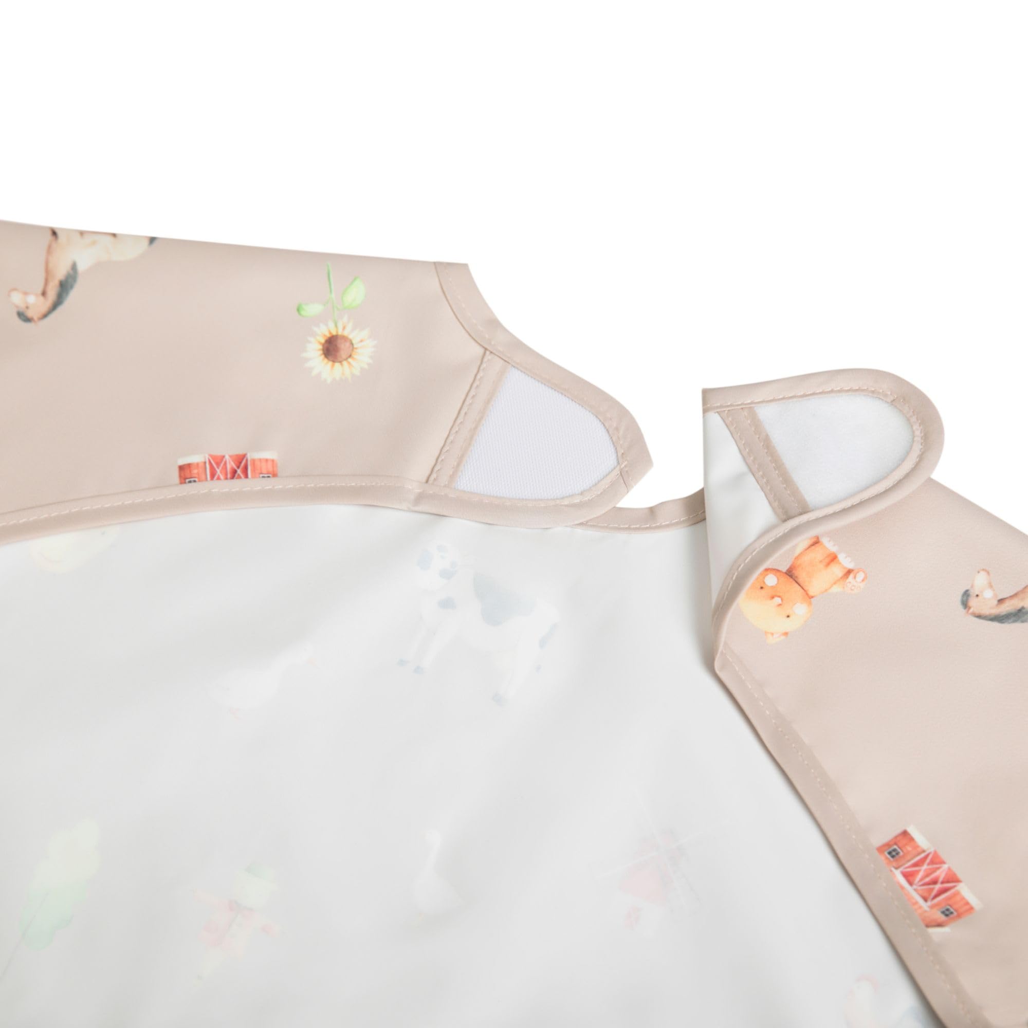 Ali+Oli Smock Bib mealtime usage supports self-feeding and mess containment