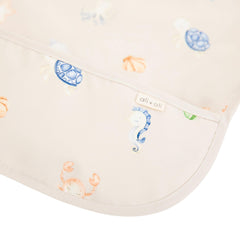 Ali+Oli Smock Bib Undersea long-sleeve side view shows adjustable fit for comfortable mealtimes.