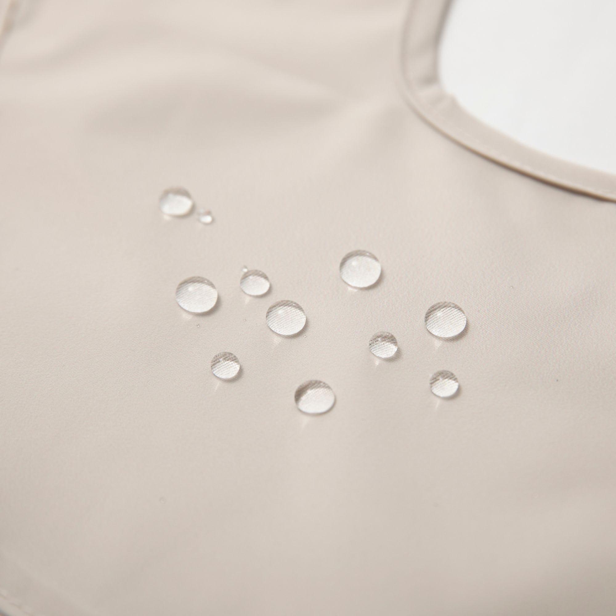 Ali+Oli Smock Bib waterproof coating in action for mess-free feeding