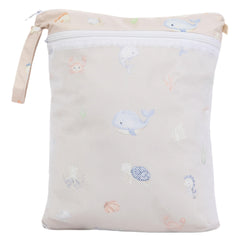 Ali+Oli wet-dry bag hooked to stroller for hands-free use.