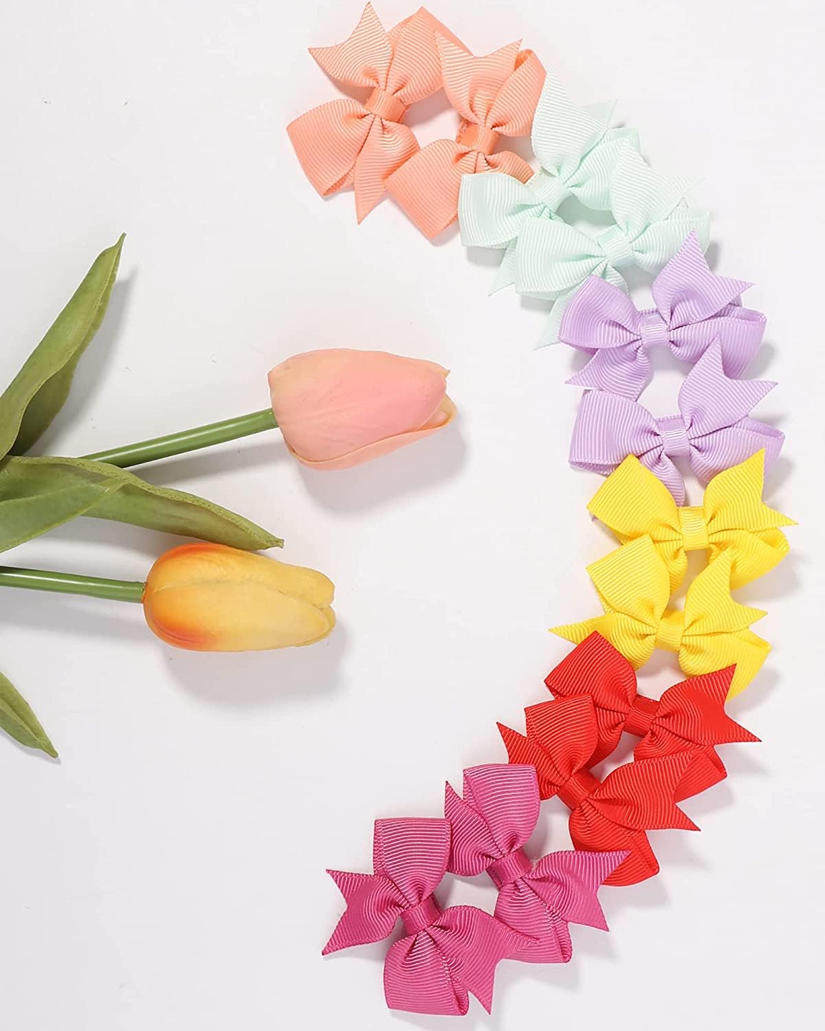 ALinmo bows fit infants to teens for versatile styling options.