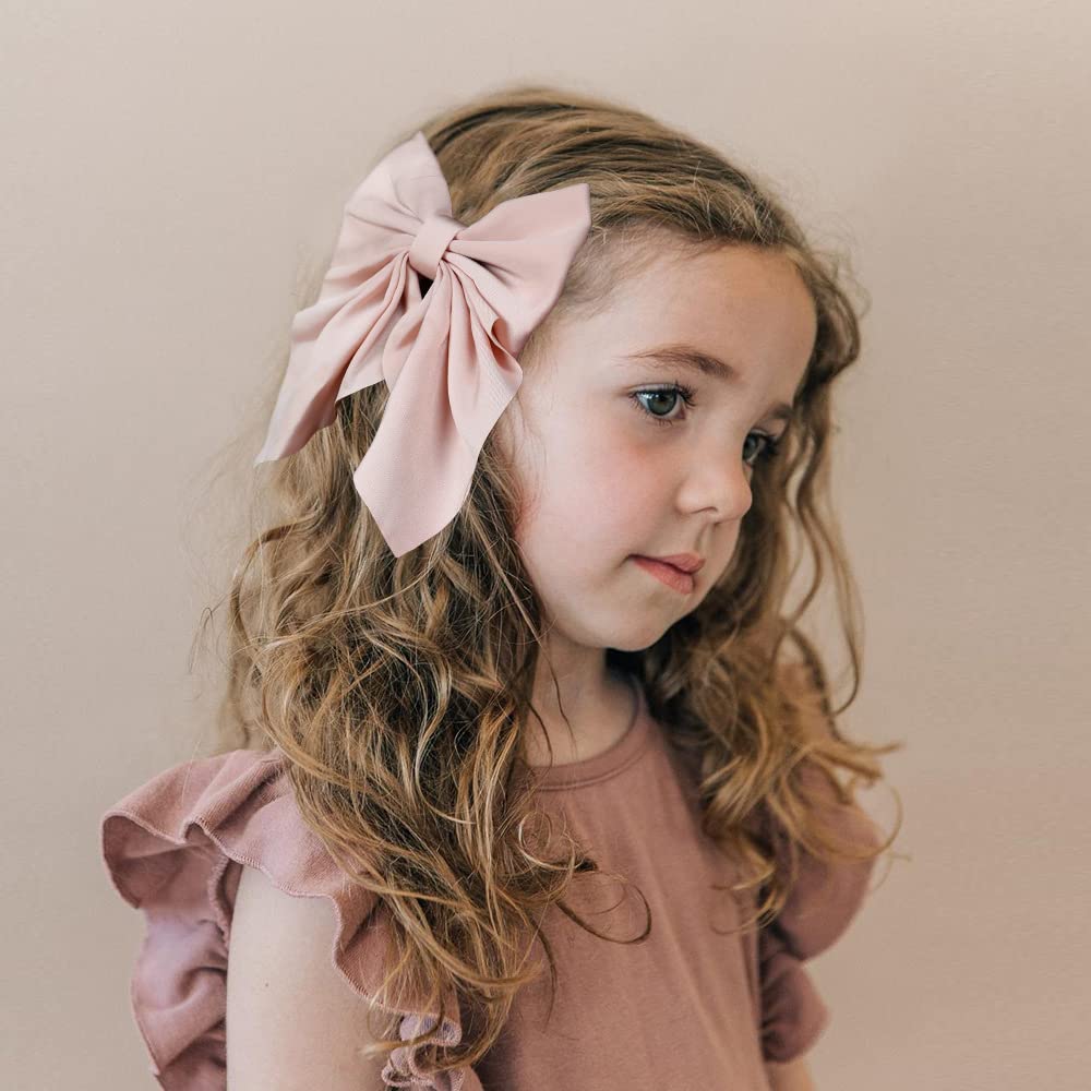 ALinmo bows worn in hair demonstrate easy styling and secure wear.