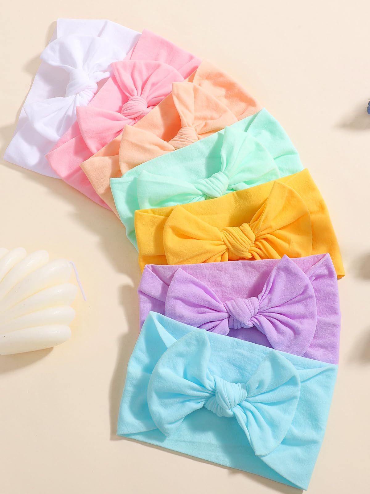 ALinmo newborn-to-toddler headbands worn in everyday moments.