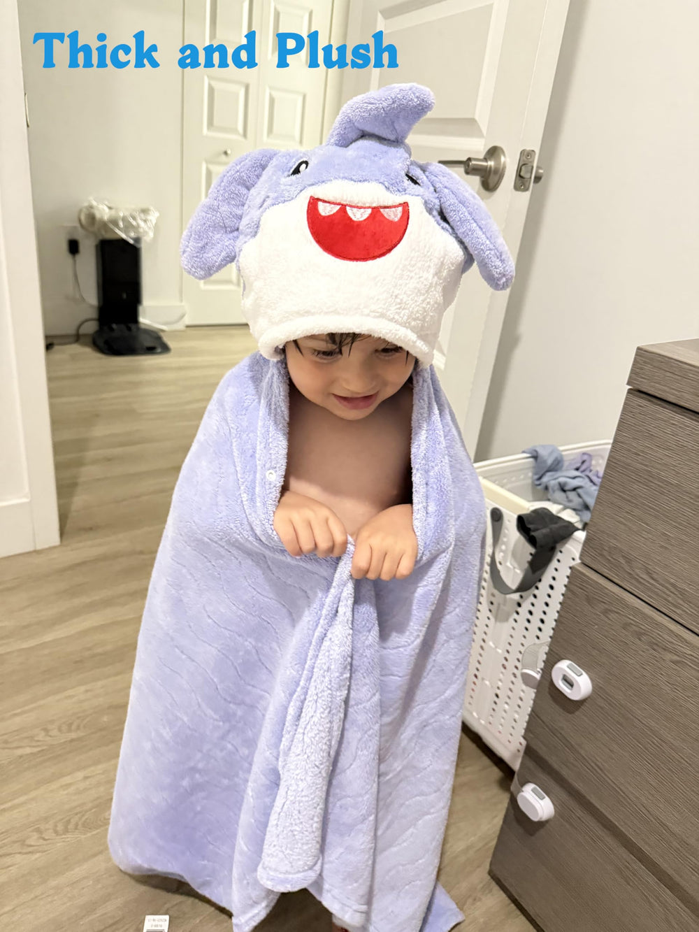 Allureza hooded towel shows 500GSM plush fleece, ultra-soft feel for sensitive skin.