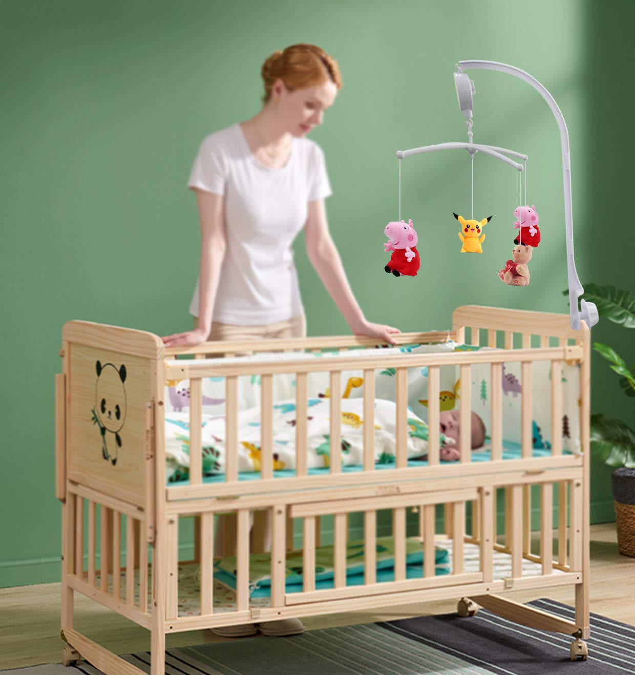 Alovexiong music box holder in use with a toy attached on a crib