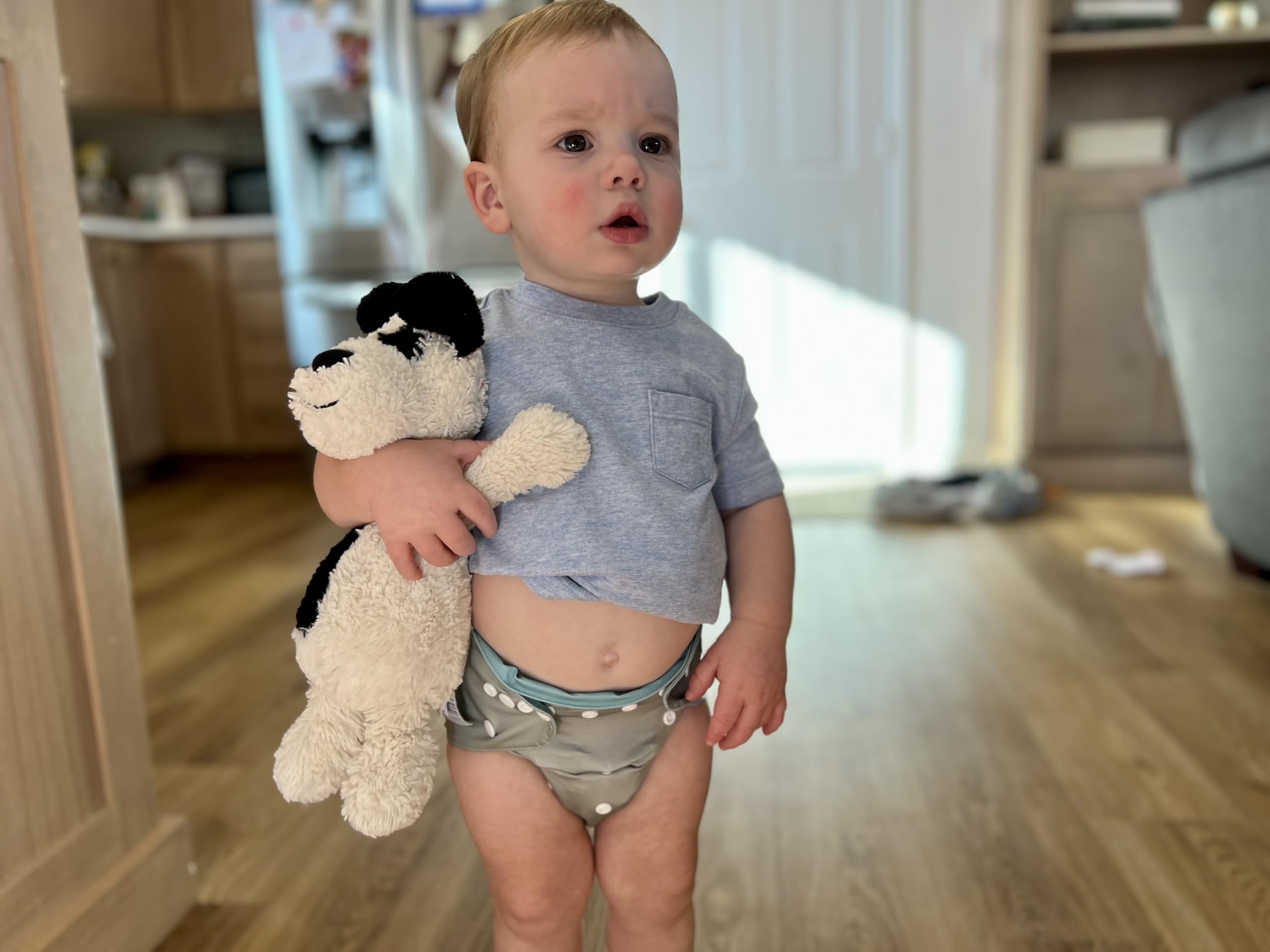 ALVA swim-diaper use image demonstrates beach-ready versatility.