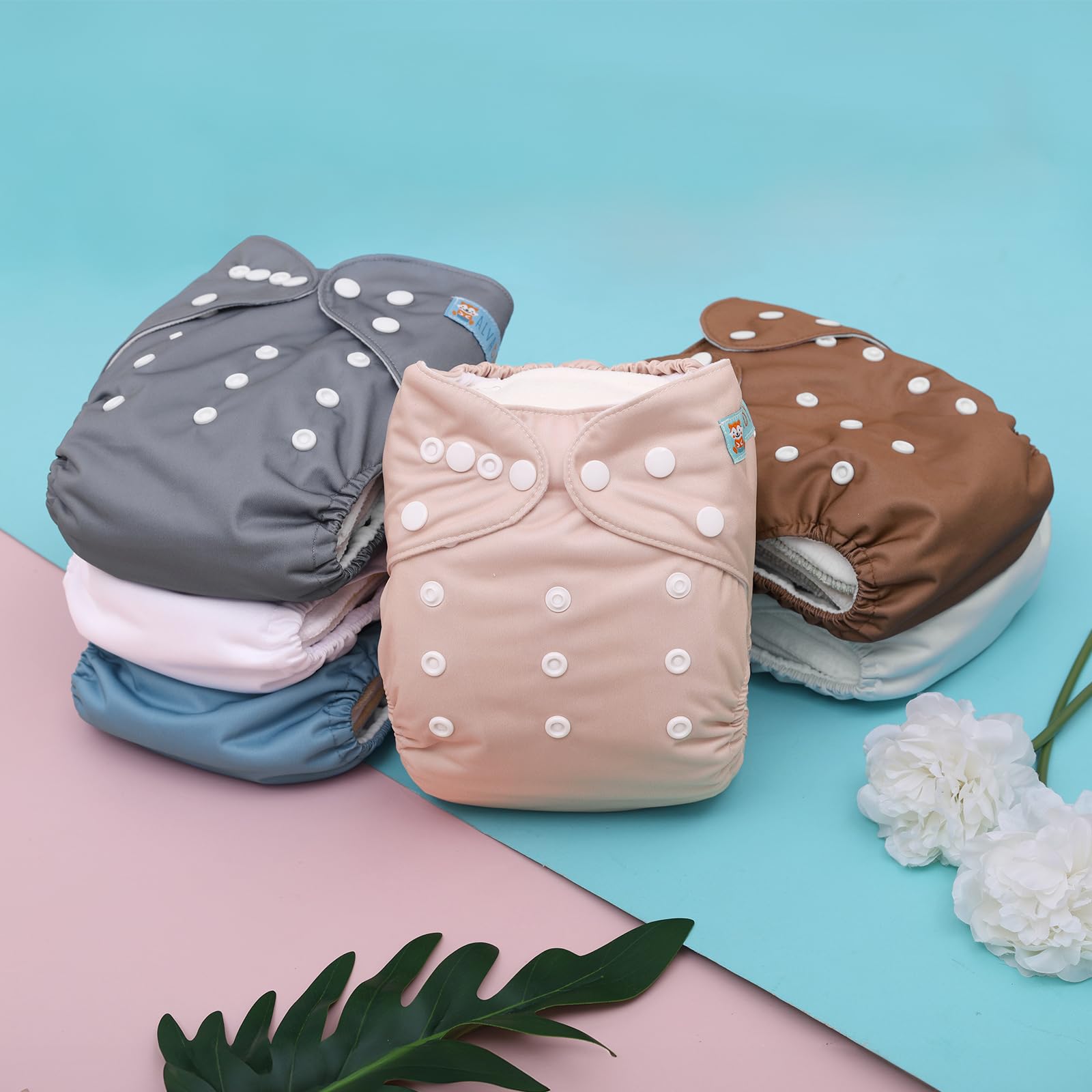 ALVABABY diaper with elastic leg openings and leak protection details