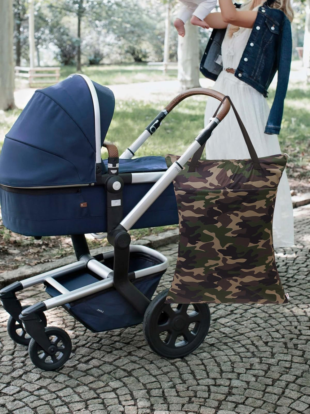 ALVABABY wet-dry bag with diapers inside demonstrates on-the-go organization.