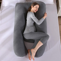 Amagoing u-shaped pillow side view demonstrates ergonomic cradle for hips and back