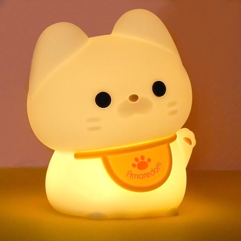 Amaredom waving kitten night light on table with gentle bedtime glow