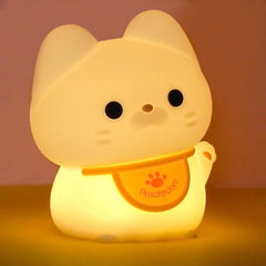 Amaredom waving kitten night light on table with gentle bedtime glow
