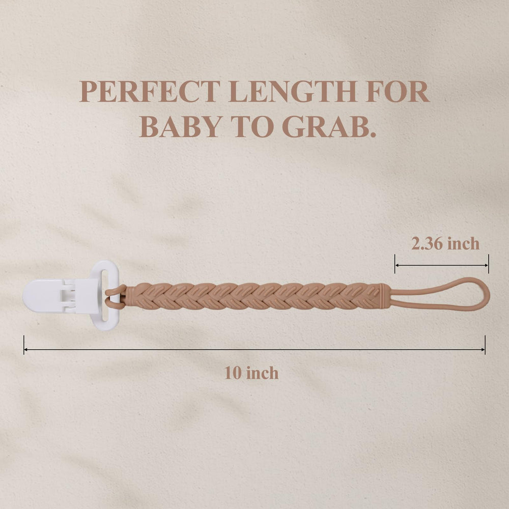 AmazingM pacifier-clip attached to baby clothes demonstrates secure attachment on outfits.