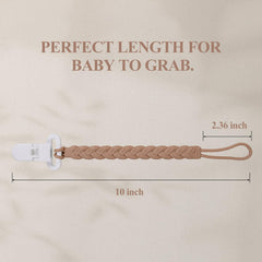 AmazingM pacifier-clip attached to baby clothes demonstrates secure attachment on outfits.