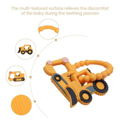 AmazingM Bulldozer teether held by baby with textured surfaces for sensory comfort.