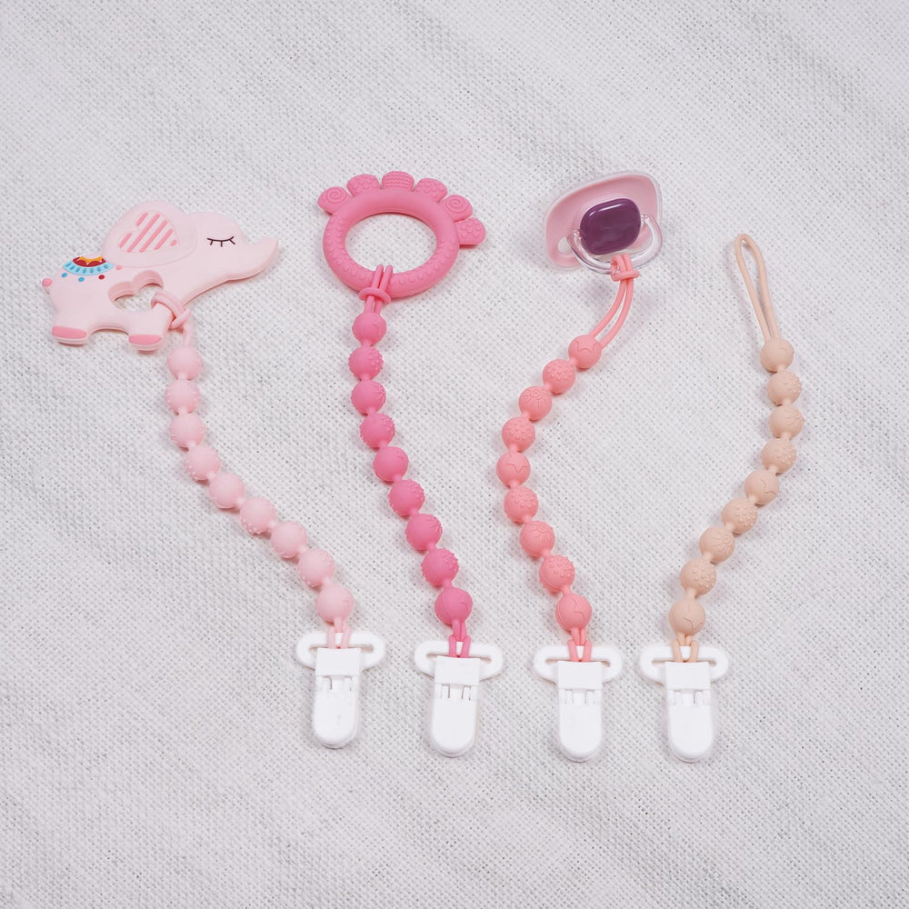 AmazingM teether clip mounted on a car seat for on the go
