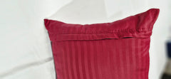 Ambition Home burgundy-striped pillowcase on toddler bed conveys cozy, stylish bedtime ambiance.
