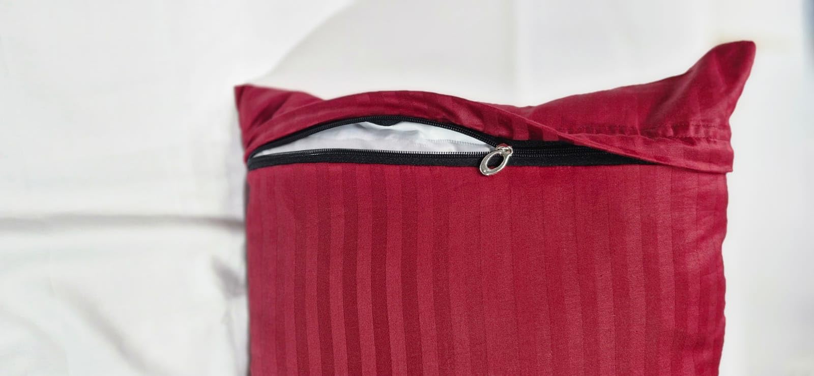 Ambition Home Egyptian cotton 550TC pillowcase close-up highlights luxurious, breathable fabric.