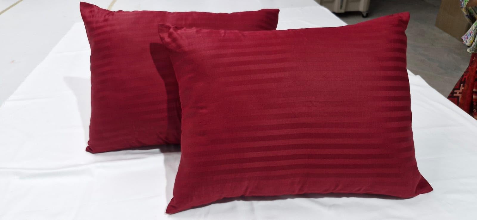 Ambition Home pack-of-2 toddler pillowcases in burgundy stripes offer convenient, durable sleep coverage.