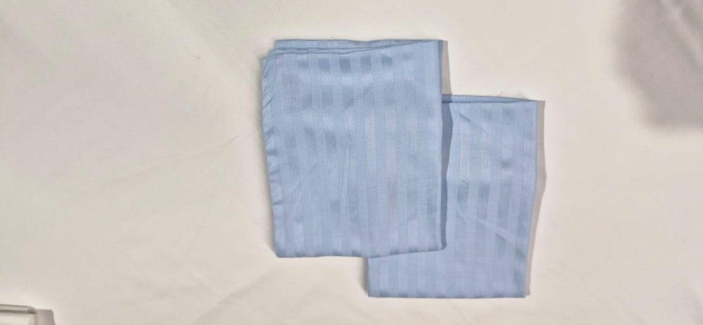 Ambition Home easy-care pillowcase highlights washable, low-maintenance fabric.