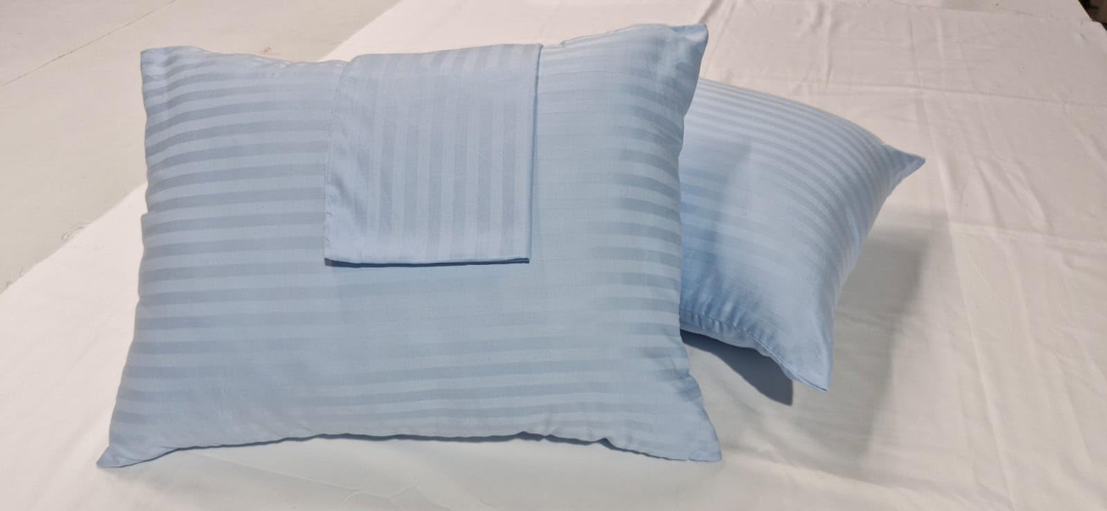 Ambition Home zipper-closure light blue closeup highlights secure fit and smooth finish.