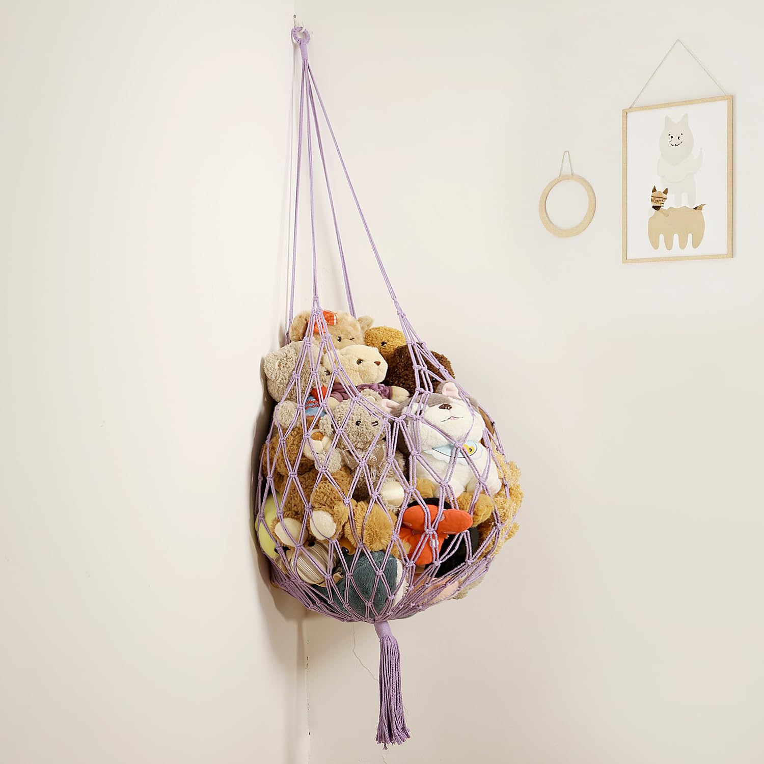 Amdermi hammock displays plush toys attractively with symmetrical tassels.