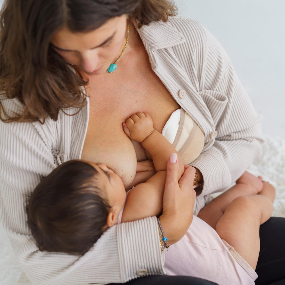 Ameda Nursing Pads contour-fit design for discreet wearing under clothes.