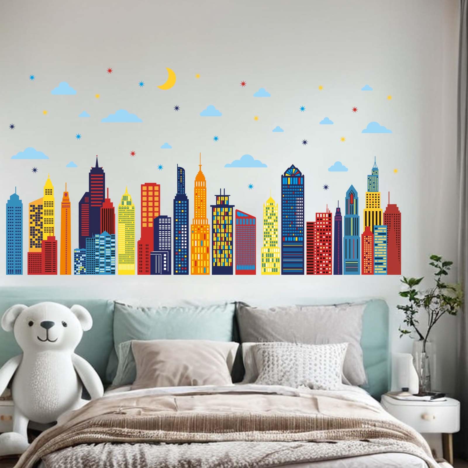 Amimagen skyline wall decals create a playful bedroom backdrop and learning atmosphere.