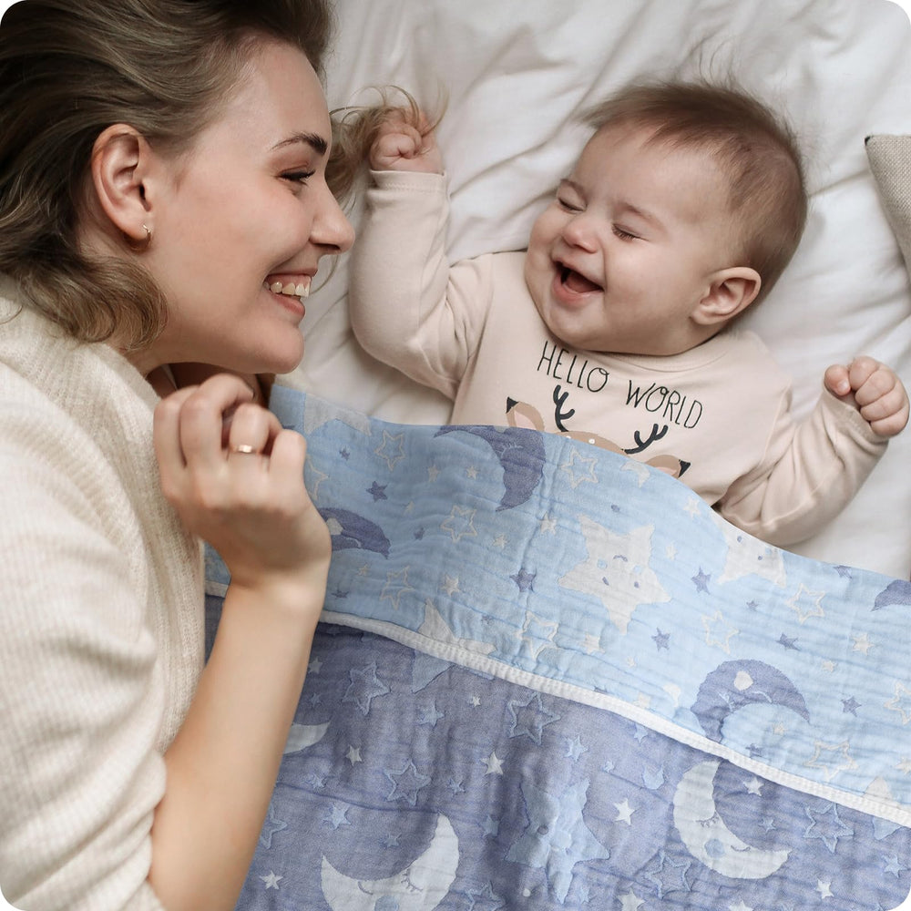 Amrcbb Cotton Muslin Blanket baby bed display emphasizes breathable layering for cozy sleep