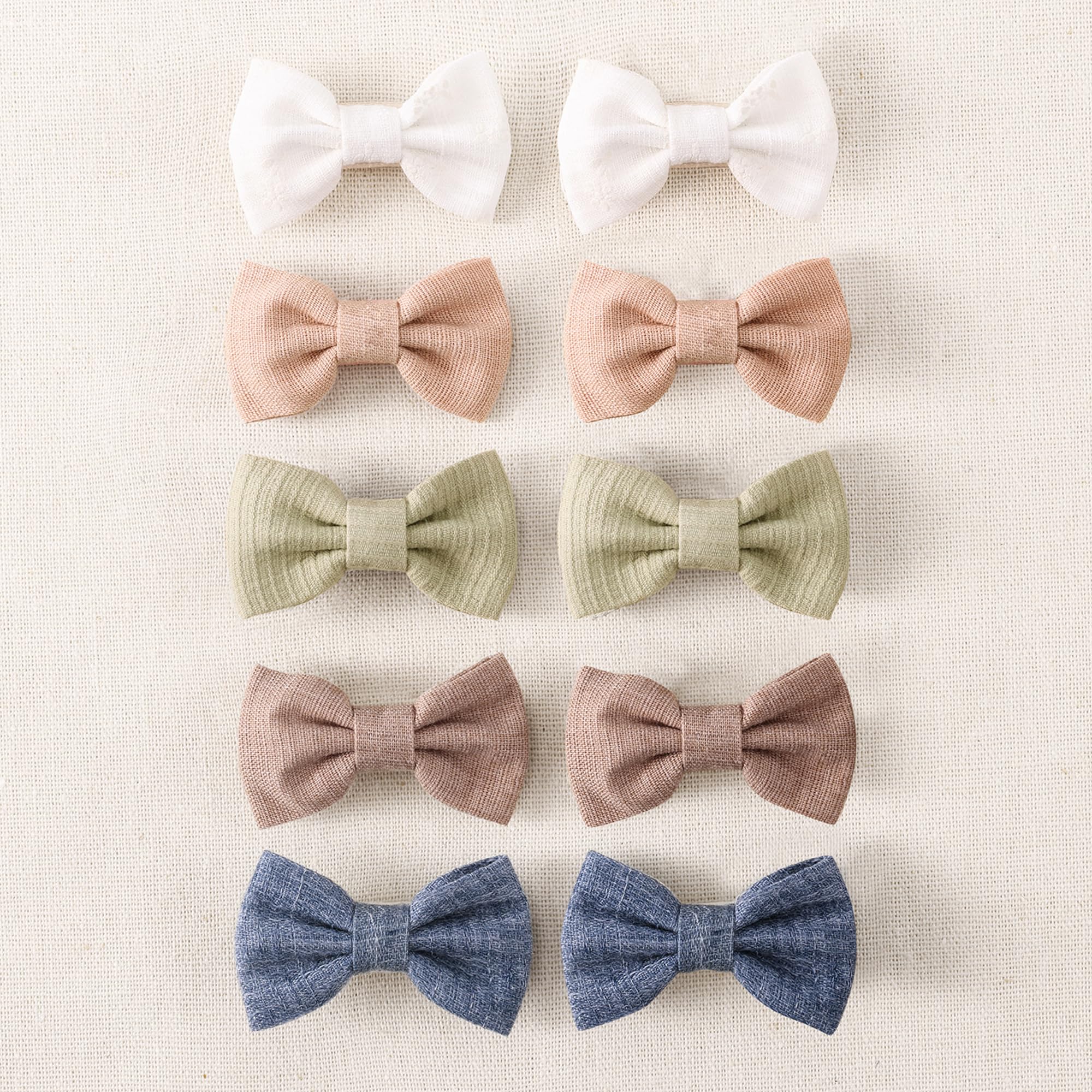 Amybasic 10pcs baby girl hair bow clip close-up showing gentle, non-slip grip for fine hair.