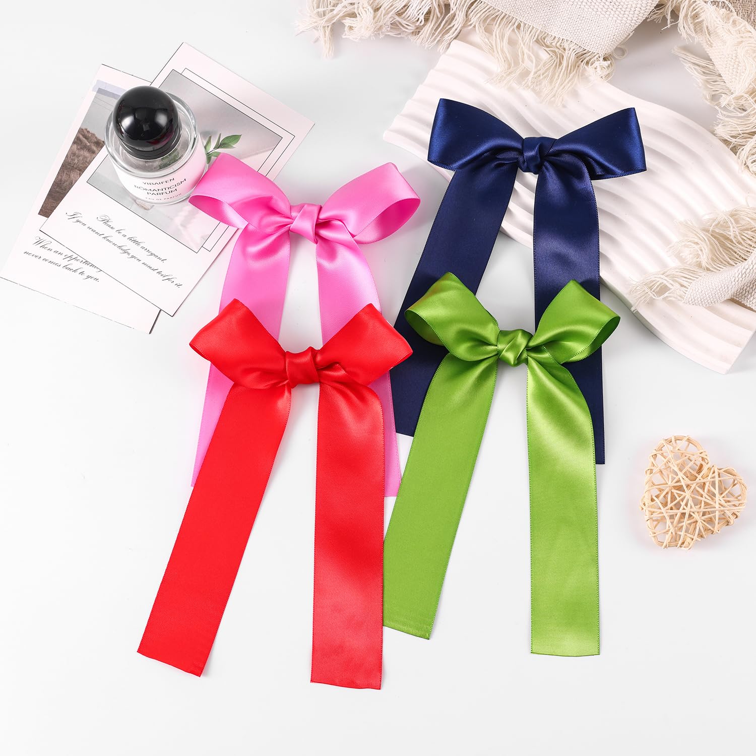 Amybasic hot pink satin bow clipped in a ponytail for secure, comfortable wear.