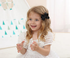 AMYDECOR 3inch satin bow black worn in hair clip in action