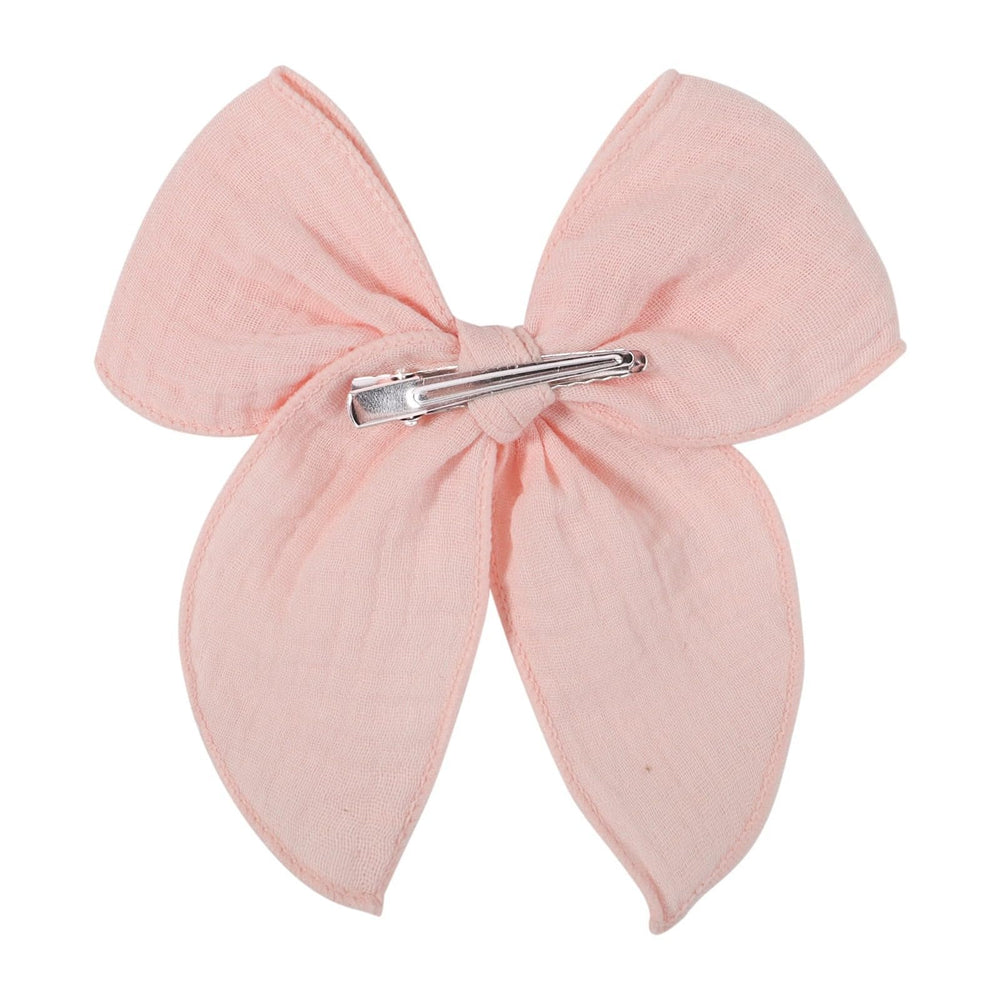 AMYDECOR 5.5-inch bow for baby girls in dark yellow on soft fabric.