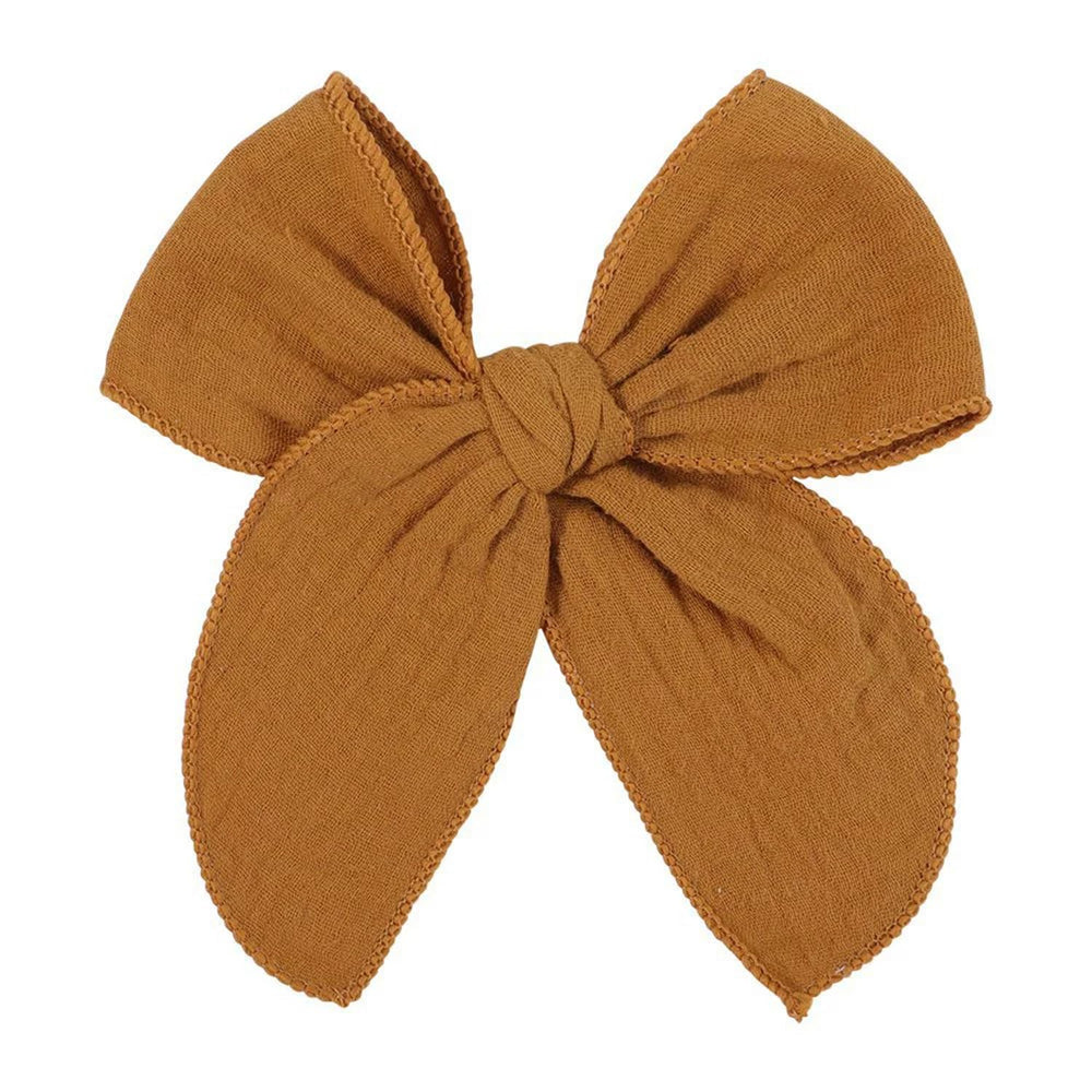 AMYDECOR dark yellow fable bow clip with linen and cotton for gentle wear.