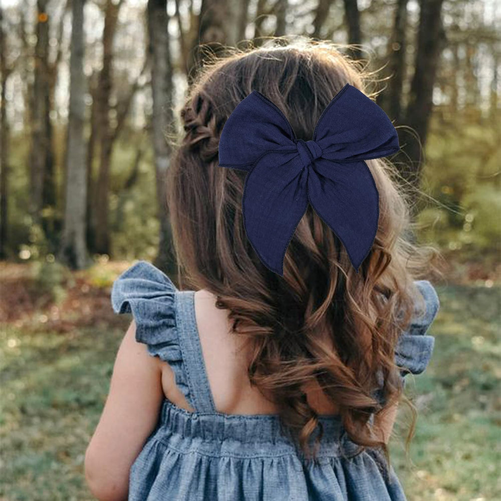 AMYDECOR Fable bow with sturdy alligator clip ready to secure hair all day.