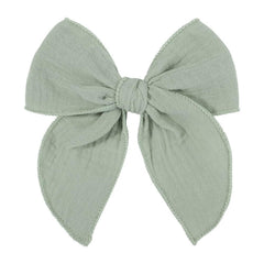 AMYDECOR light-green fable bow enhances outfits with soft linen texture and all-day comfort.