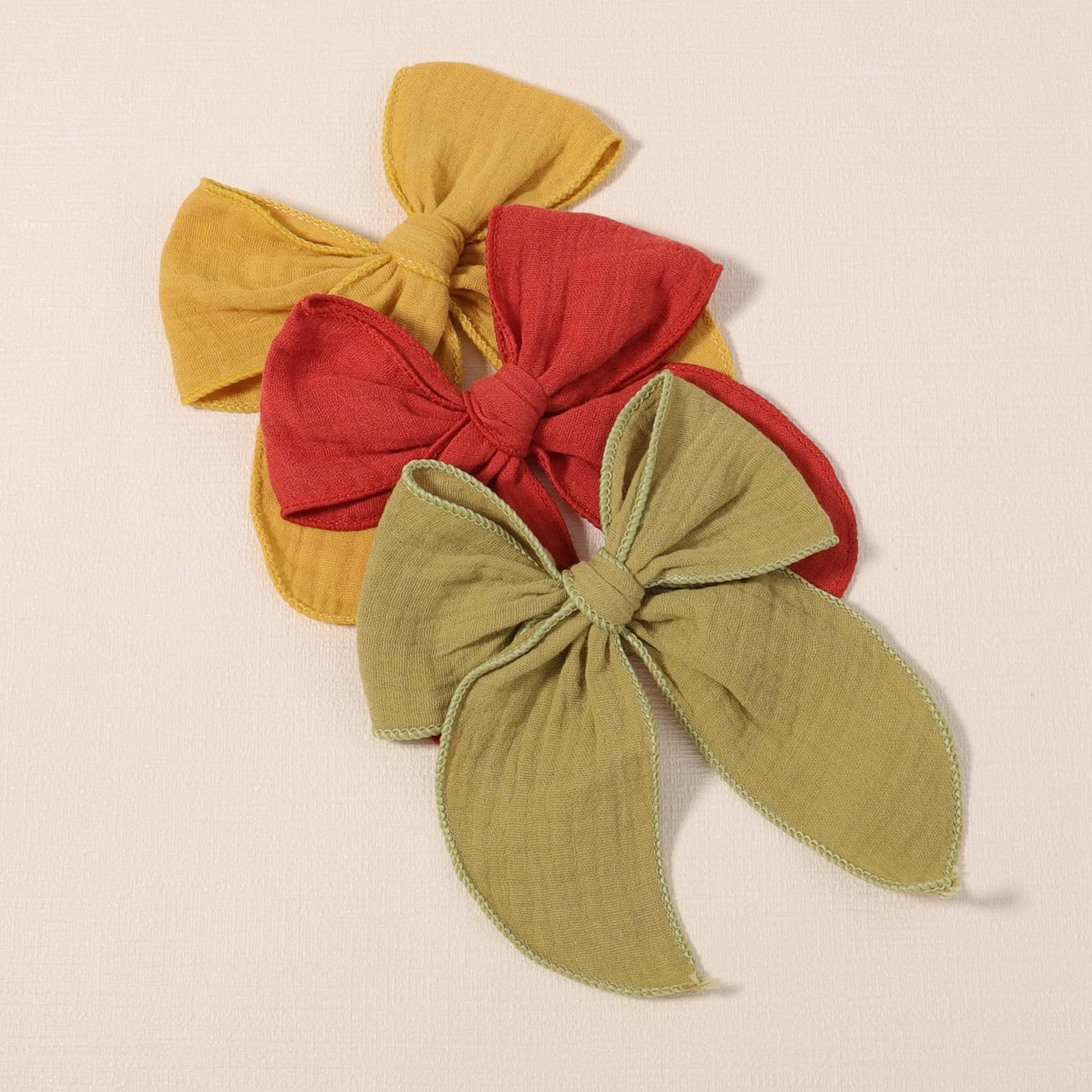 AMYDECOR Yellow Fable Bow in baby hairstyle shows versatile styling options.