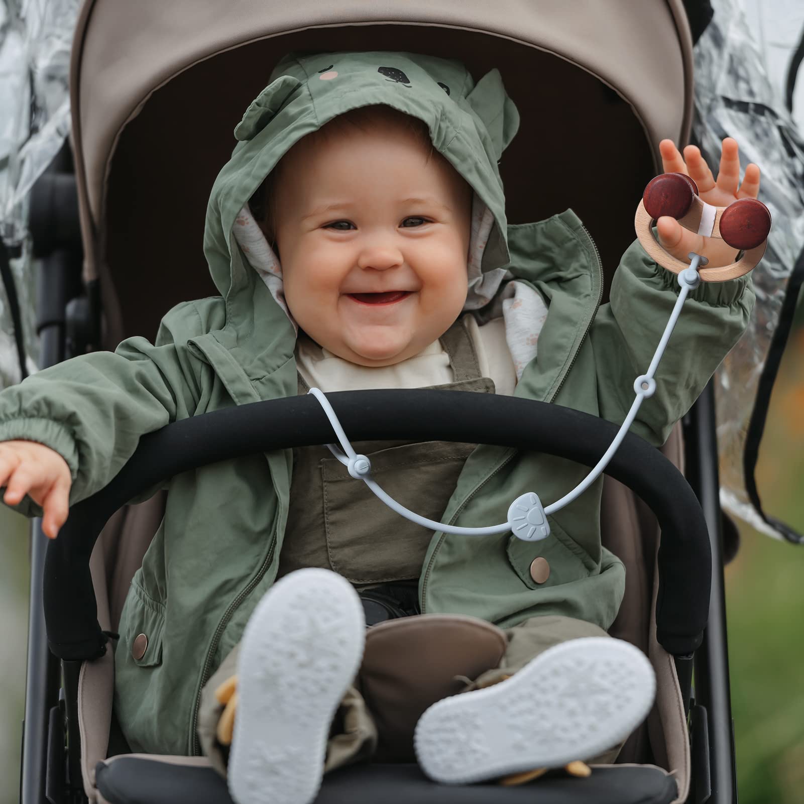 Andy Bear high-chair clip keeps items secure during feeding.