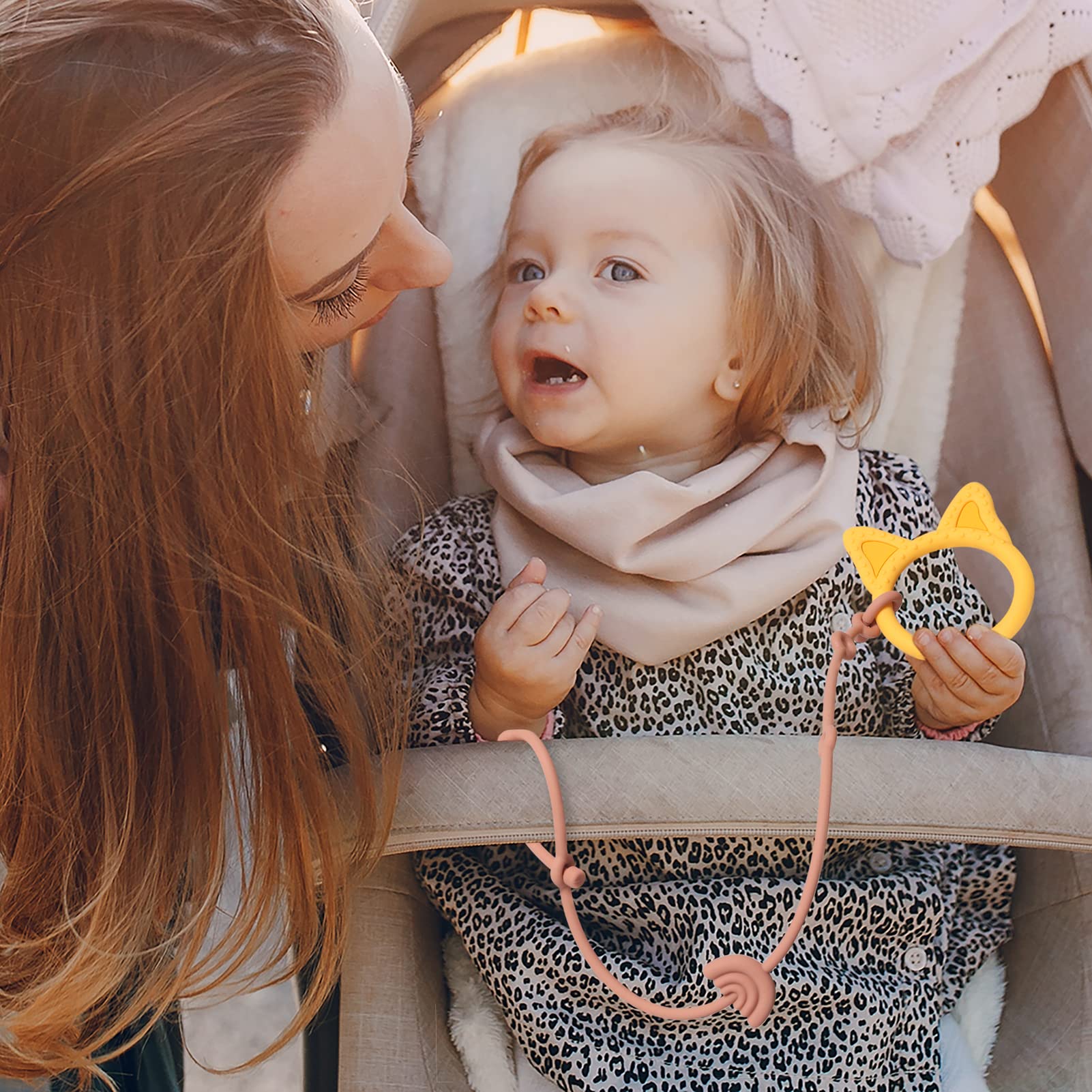 Andy Bear stroller-attachment keeps items secure on the go.
